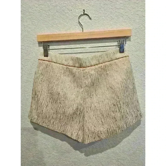 Forever 21 Pants - Forever 21 White and gold mini shorts. Size Small.